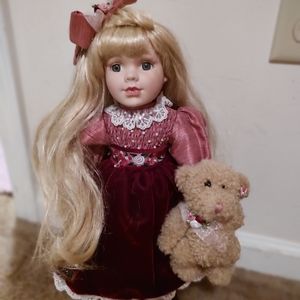 Victorian collection porcelain doll with stand holding her favorite bear!